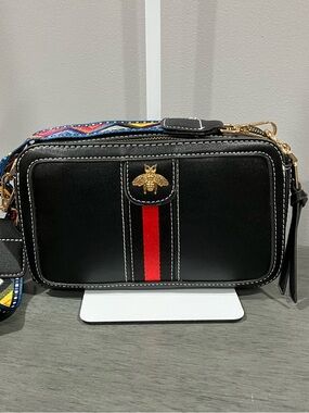 Black Crossbody Bag with Red Stripe and Bee Accent